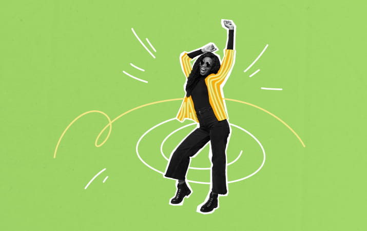 A woman dancing with her hands in the air against a green background