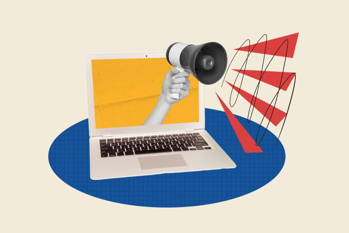 A laptop with a megaphone coming out of it